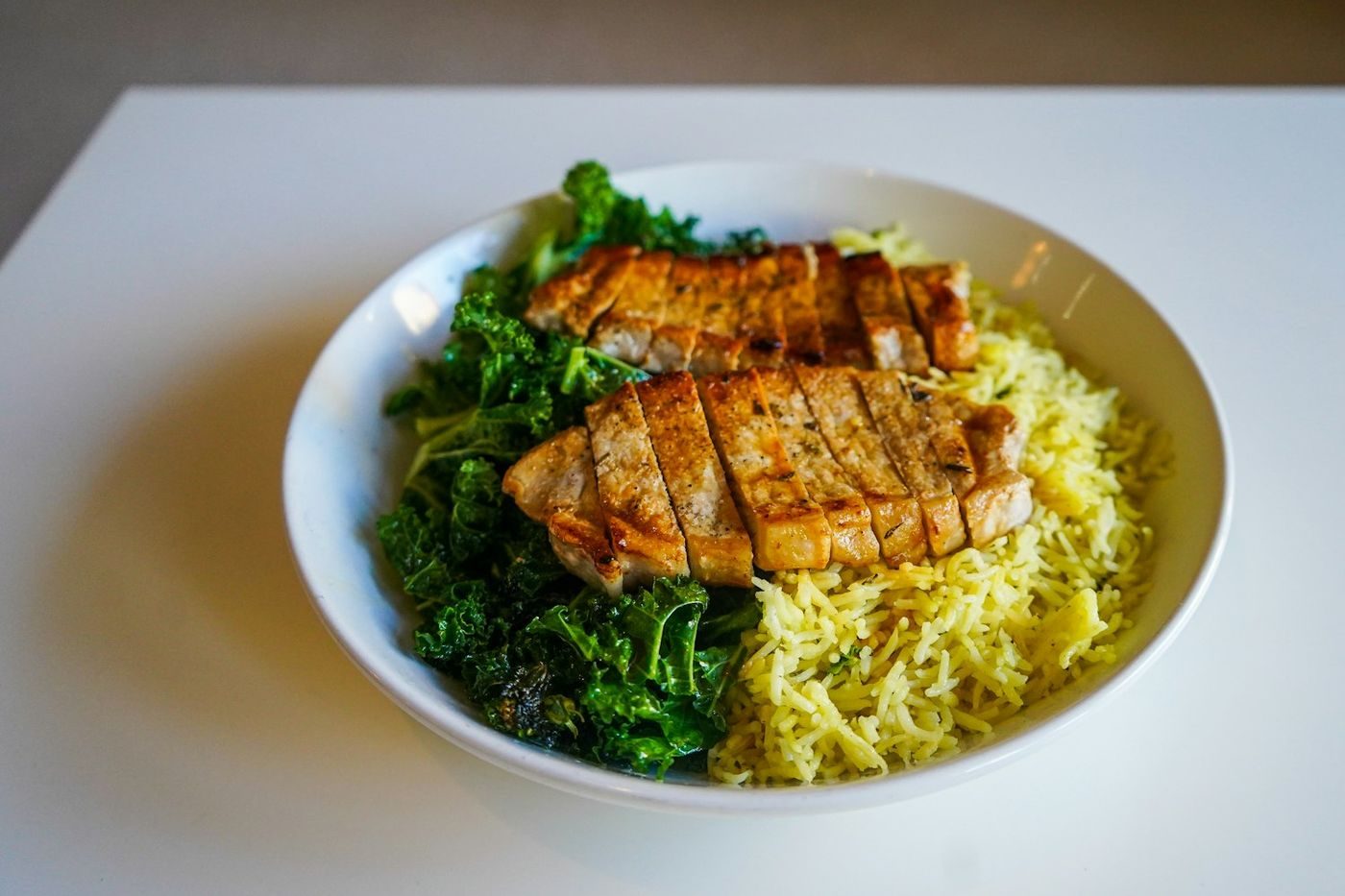 Herb-marinated chicken with saffron rice
